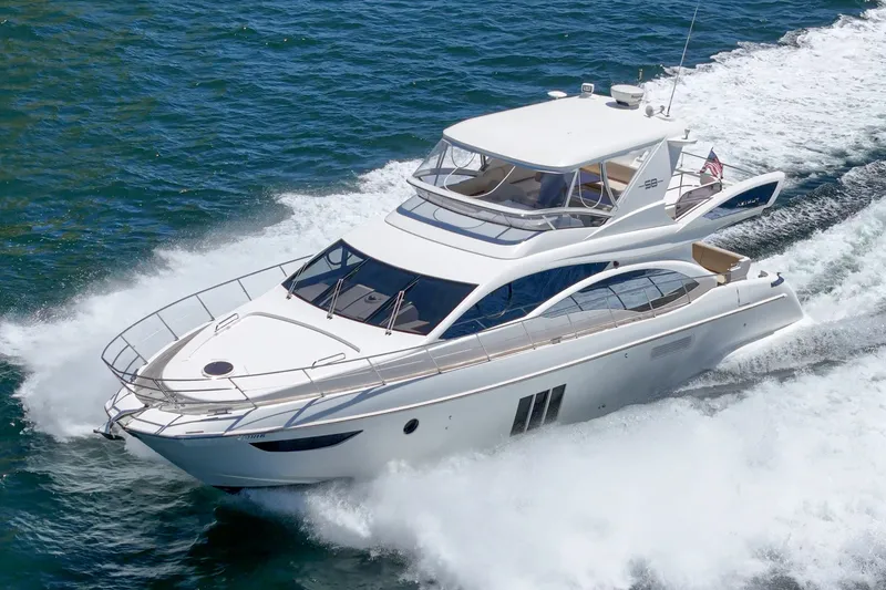 Slide: The Image of Luxurious 2010 Azimut 58 yacht cruising swiftly on open water. - 15