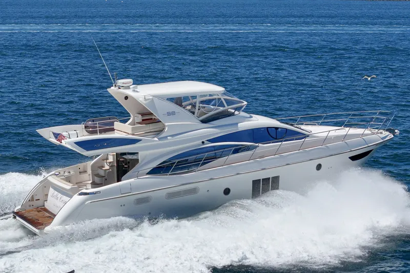 The Image of Luxurious 2010 Azimut 58 yacht cruising on open sea with waves. - 1