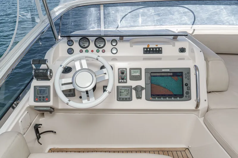 Slide: The Image of Cockpit of 2010 Azimut 58 yacht with navigation instruments and steering wheel. - 42