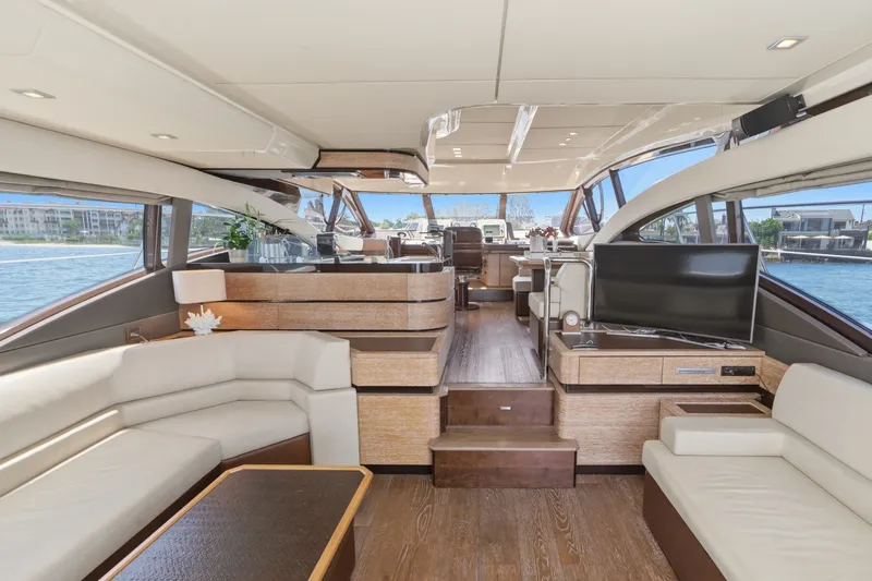 Slide: The Image of Luxurious interior of a 2010 Azimut 58 yacht with modern furnishings and panoramic windows. - 63