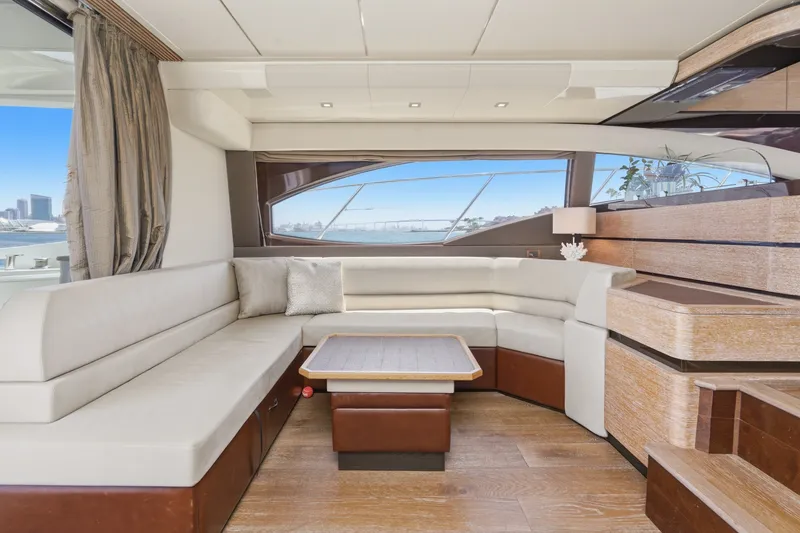 Slide: The Image of Luxurious interior of 2010 Azimut 58 yacht with elegant seating and scenic window view. - 61