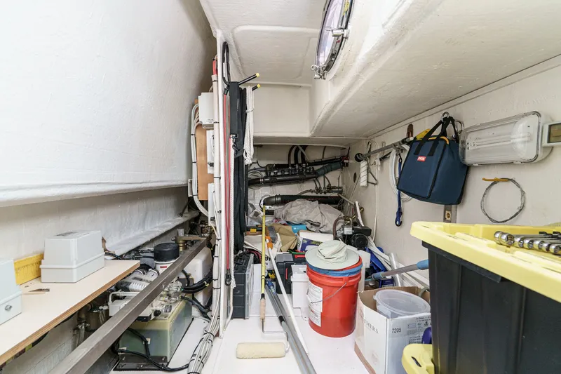 Slide: The Image of Interior storage area of a 2010 Azimut 58 yacht, featuring equipment and supplies. - 99