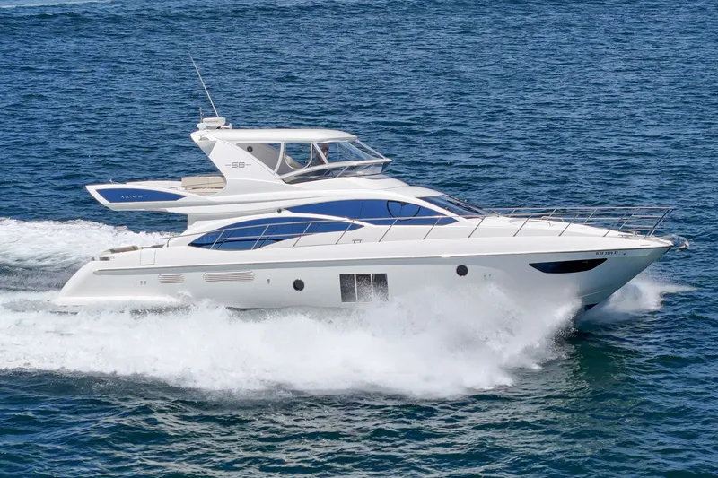 Slide: The Image of Luxury 2010 Azimut 58 yacht cruising on open water. - 23
