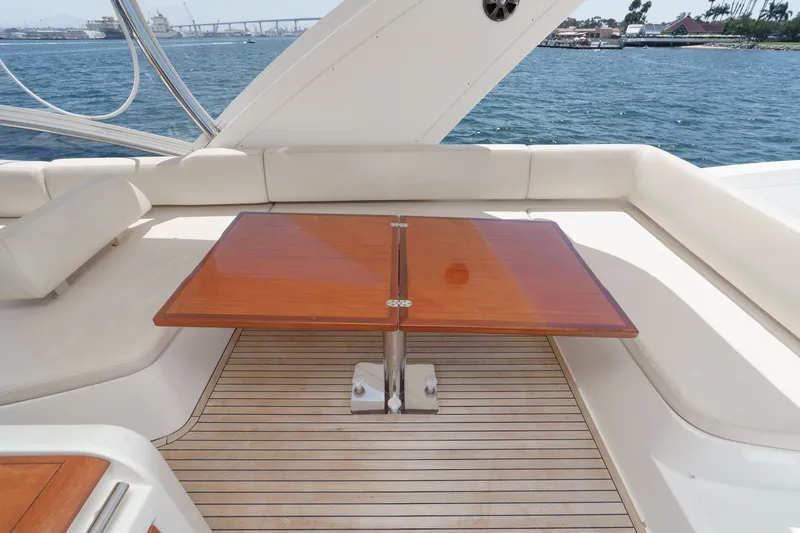 Slide: The Image of Luxurious seating area on a 2010 Azimut 58 yacht with wooden table and ocean view. - 50