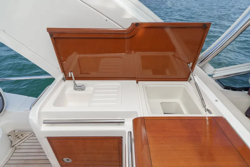 Slide: The Image of Outdoor sink and storage area on a 2010 Azimut 58 yacht, overlooking the ocean. - 45