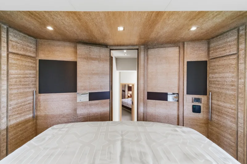Slide: The Image of Luxurious interior of 2010 Azimut 58 yacht bedroom with modern wood paneling. - 82