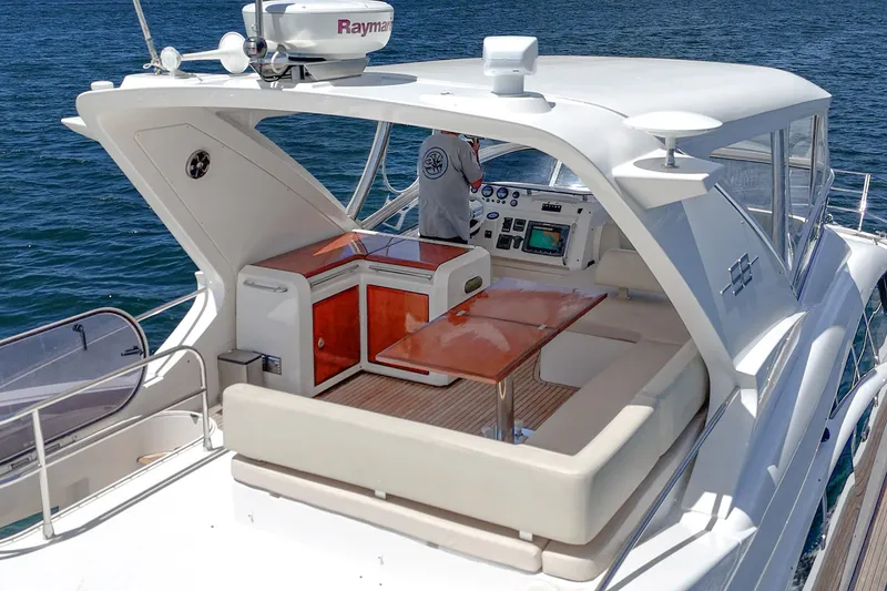 Slide: The Image of Luxurious 2010 Azimut 58 yacht with elegant seating and navigation equipment on open water. - 37