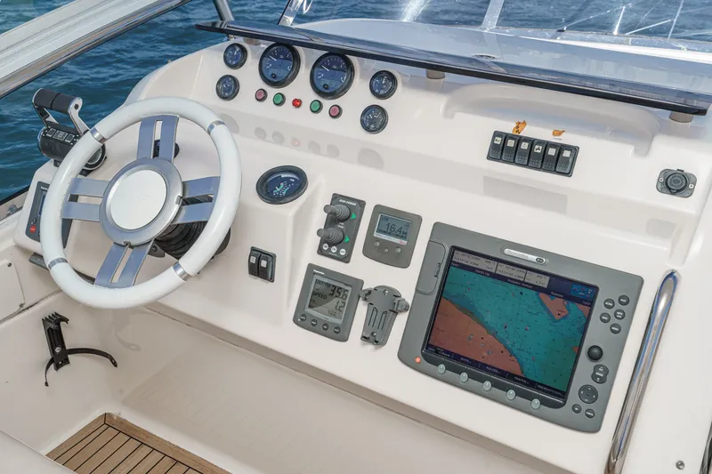 Slide: The Image of Cockpit of 2010 Azimut 58 yacht with navigation instruments and steering wheel. - 43