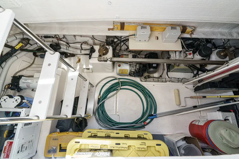 Slide: The Image of Engine room of a 2010 Azimut 58 yacht with equipment and storage. - 98