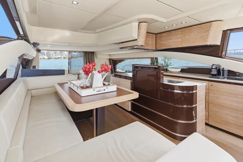 Slide: The Image of Luxurious interior of 2010 Azimut 58 yacht with elegant dining and kitchen area. - 69