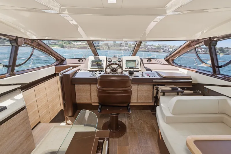 Slide: The Image of Luxurious interior of 2010 Azimut 58 yacht with modern helm and panoramic windows. - 74