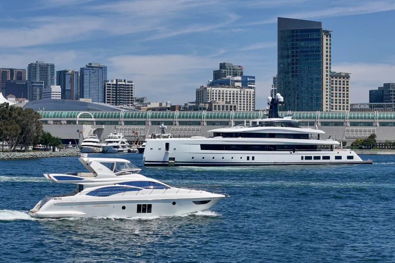 Slide: The Image of 2010 Azimut 58 yacht cruising in urban waterfront with skyscrapers in background. - 26