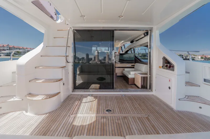 Slide: The Image of Luxurious 2010 Azimut 58 yacht interior with elegant wood flooring and modern seating. - 55