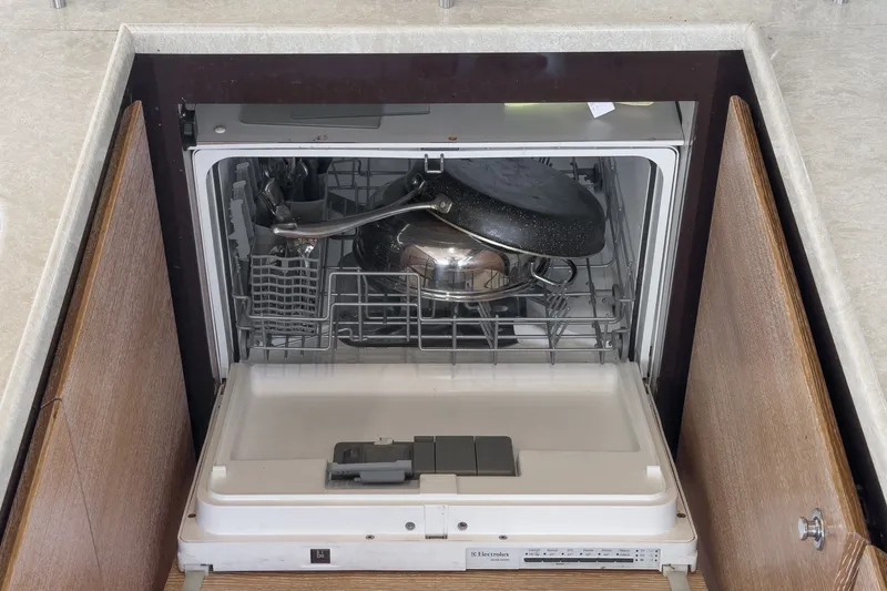Slide: The Image of Built-in Electrolux dishwasher on Azimut 58 yacht, loaded with cookware. - 73