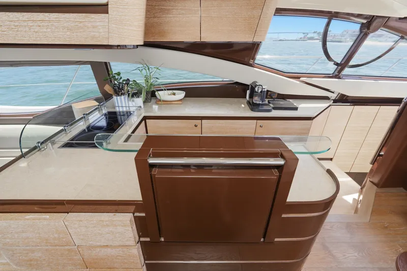 Slide: The Image of Luxurious kitchen interior of 2010 Azimut 58 yacht with modern appliances and ocean view. - 70