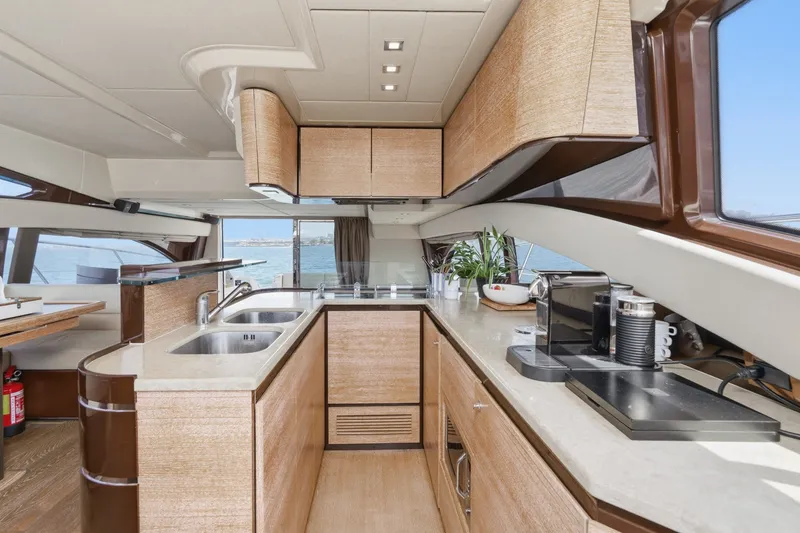 Slide: The Image of Luxurious kitchen interior of 2010 Azimut 58 yacht with modern appliances and ocean view. - 72