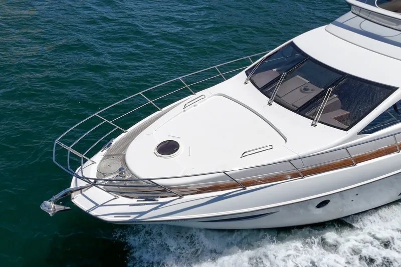 Slide: The Image of Luxury 2010 Azimut 58 yacht cruising on clear blue water. - 34