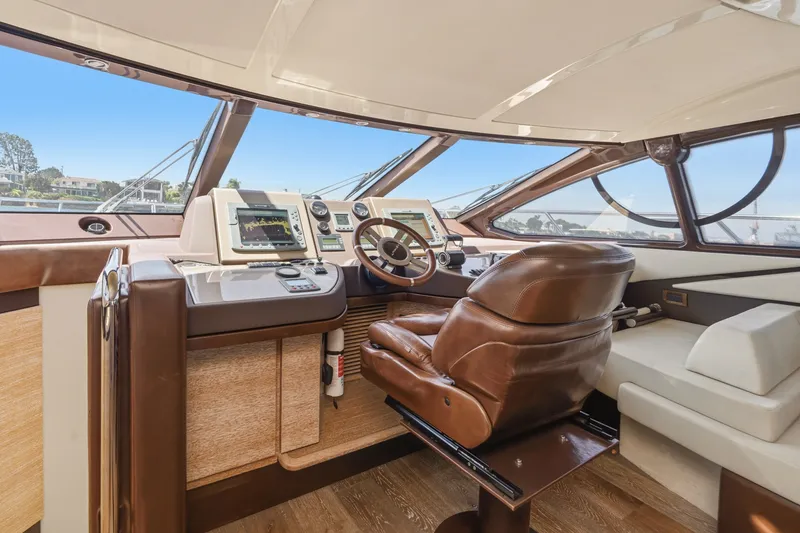 Slide: The Image of Luxurious helm of 2010 Azimut 58 yacht with leather seating and advanced navigation systems. - 76