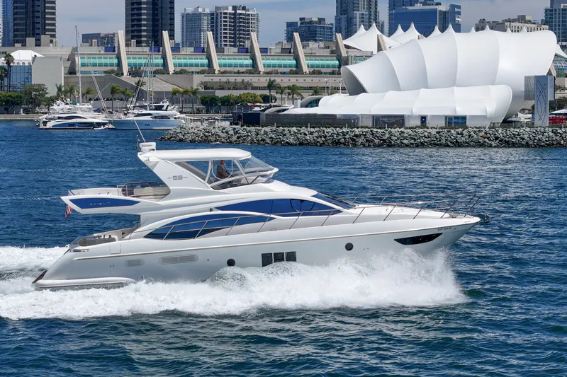 Slide: The Image of Luxury Azimut 58 yacht cruising near modern waterfront architecture, 2010 model. - 16