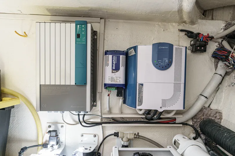 Slide: The Image of Electrical equipment setup on a 2010 Azimut 58 yacht, featuring Mastervolt and Dolphin components. - 102