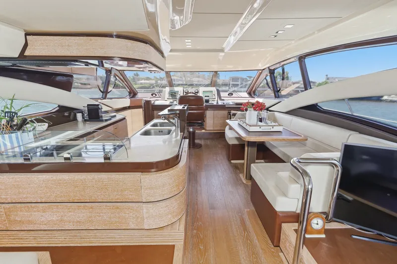 Slide: The Image of Luxurious interior of a 2010 Azimut 58 yacht with modern kitchen and seating area. - 64