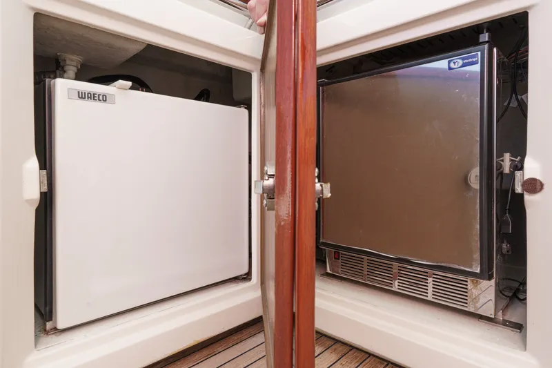 Slide: The Image of Dual refrigerators on a 2010 Azimut 58 yacht, featuring Waeco and Vitrifrigo units. - 47