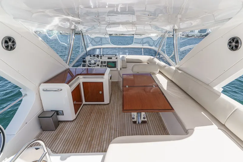 Slide: The Image of Luxurious interior of a 2010 Azimut 58 yacht with elegant seating and wooden table. - 38