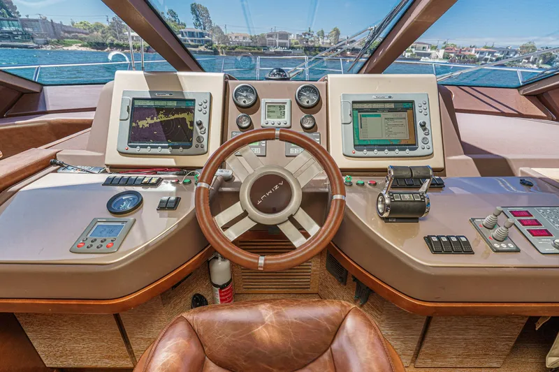 Slide: The Image of Cockpit of 2010 Azimut 58 yacht with navigation instruments and leather steering wheel. - 77