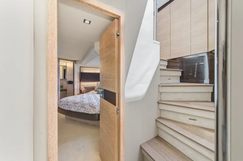 Slide: The Image of Interior of 2010 Azimut 58 yacht showing bedroom and staircase. - 86