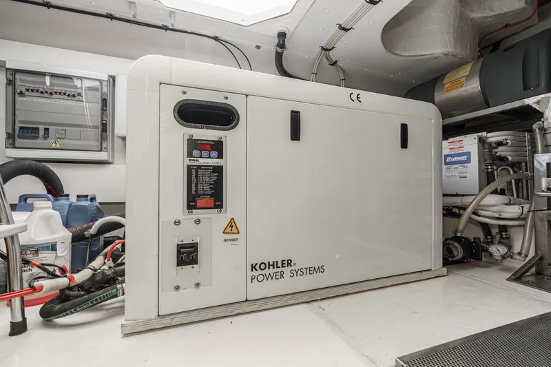 Slide: The Image of Engine room of 2010 Azimut 58 yacht featuring Kohler power systems generator. - 107