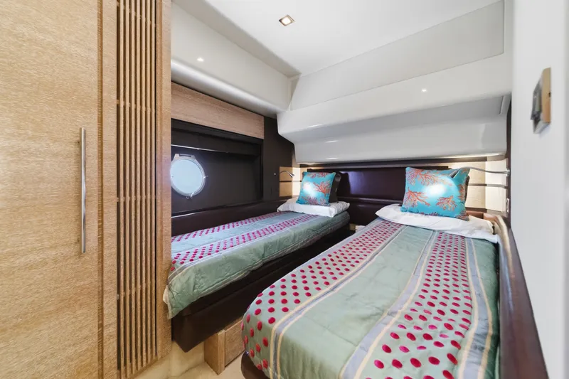 Slide: The Image of Luxurious twin cabin interior of 2010 Azimut 58 yacht with stylish bedding and decor. - 84
