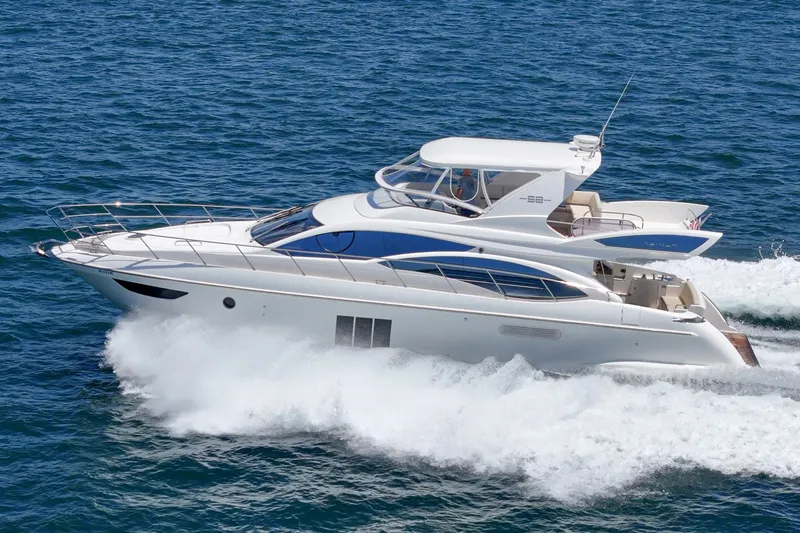 Slide: The Image of Luxury 2010 Azimut 58 yacht cruising on open water. - 14