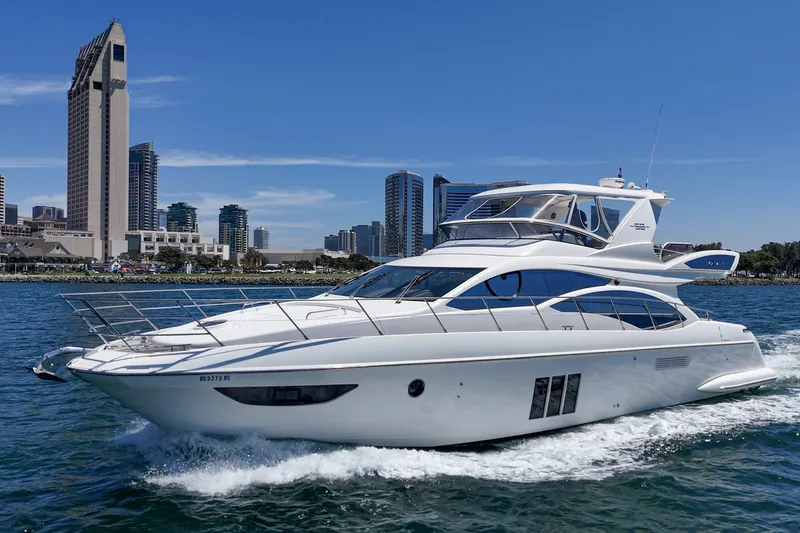 Slide: The Image of Luxury 2010 Azimut 58 yacht cruising near city skyline on a sunny day. - 32