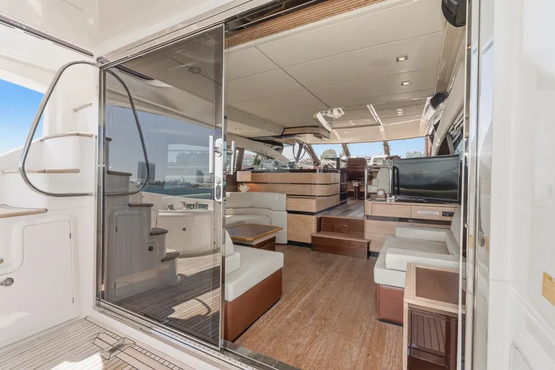 Slide: The Image of Luxurious interior of a 2010 Azimut 58 yacht, featuring elegant seating and modern design. - 58