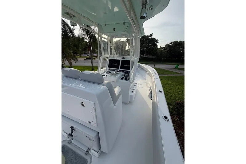 Slide: The Image of 2019 Conch 30 boat interior with helm, seating, and navigation equipment. - 16