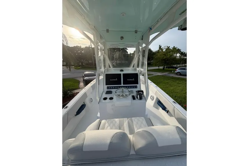 Slide: The Image of 2019 Conch 30 boat cockpit with Garmin navigation system and dual seating. - 13