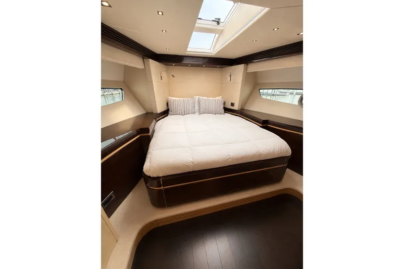 Slide: The Image of Luxurious bedroom interior of 2014 Sunseeker Predator 68 yacht with skylight and elegant bedding. - 34