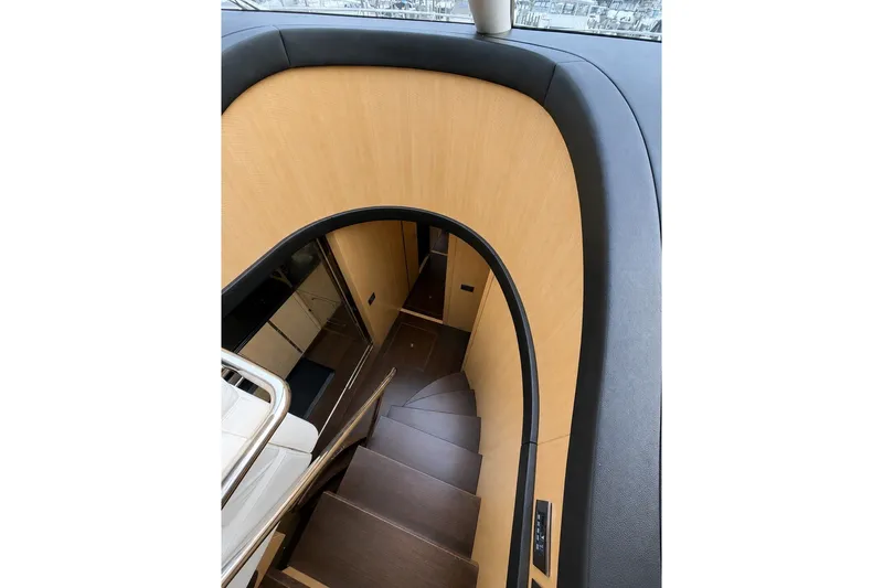 Slide: The Image of Interior staircase of 2014 Sunseeker Predator 68 yacht, featuring sleek wood and modern design. - 31