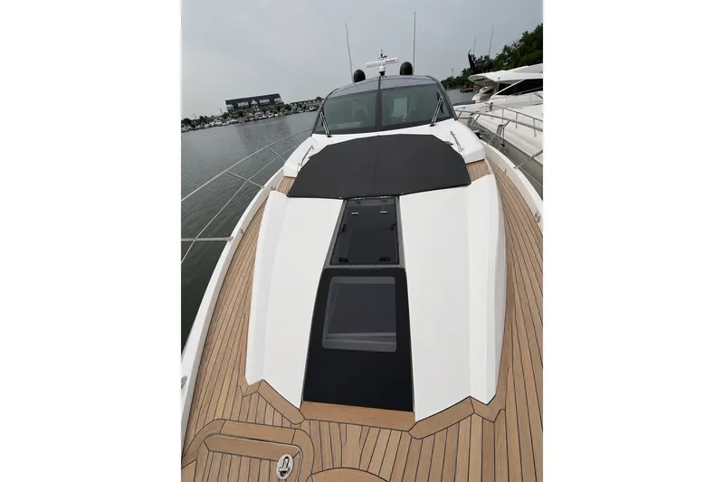 Slide: The Image of 2014 Sunseeker Predator 68 yacht with sleek deck design and modern features. - 21