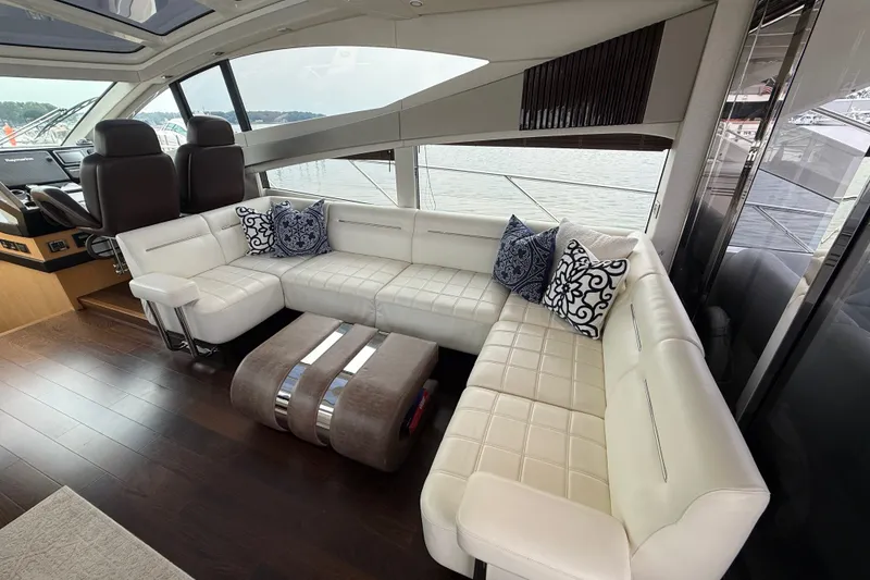 Slide: The Image of Luxurious interior of 2014 Sunseeker Predator 68 yacht with white leather seating and decorative pillows. - 25