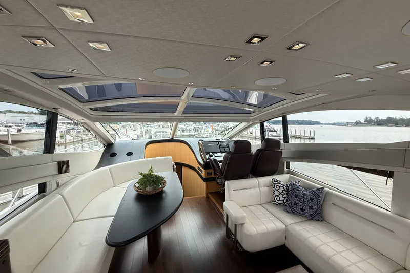 Slide: The Image of Luxurious interior of 2014 Sunseeker Predator 68 yacht with panoramic windows and elegant seating. - 29