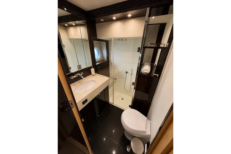 Slide: The Image of Luxurious bathroom in 2014 Sunseeker Predator 68 yacht, featuring modern fixtures and elegant design. - 23