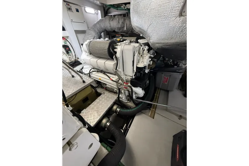 Slide: The Image of Engine room of 2014 Sunseeker Predator 68 yacht, showcasing advanced machinery and components. - 60