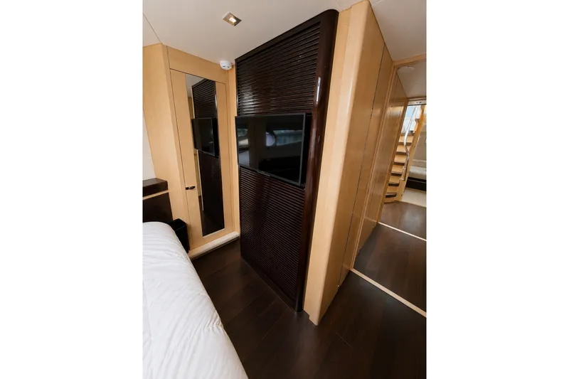 Slide: The Image of Interior of 2014 Sunseeker Predator 68 yacht with modern wood paneling and TV. - 32