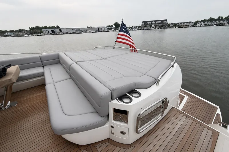 Slide: The Image of Luxurious 2014 Sunseeker Predator 68 yacht with spacious deck and American flag. - 13