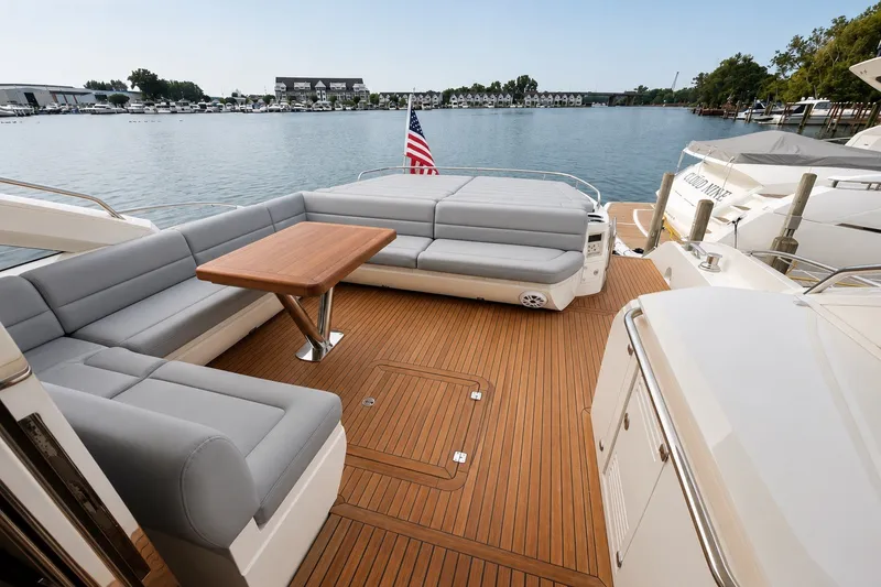 Slide: The Image of Luxurious 2014 Sunseeker Predator 68 yacht deck with elegant seating and wooden flooring. - 14