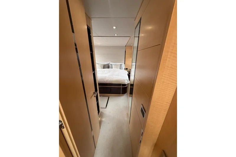 Slide: The Image of Luxurious bedroom interior of 2014 Sunseeker Predator 68 yacht, featuring elegant wood finishes. - 47