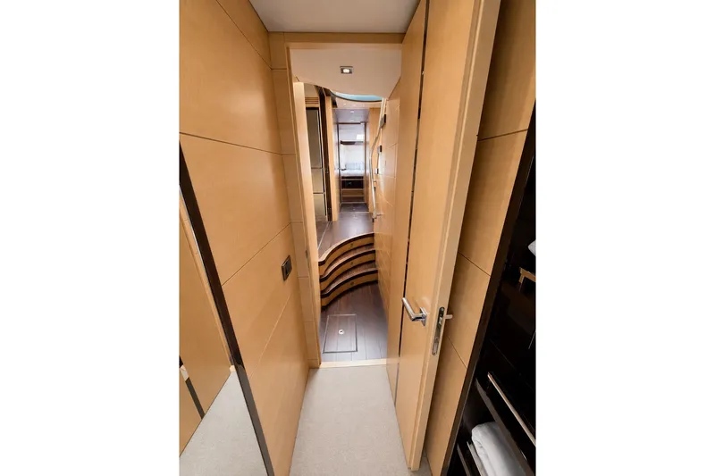 Slide: The Image of Interior hallway of 2014 Sunseeker Predator 68 yacht, featuring sleek wooden design. - 38