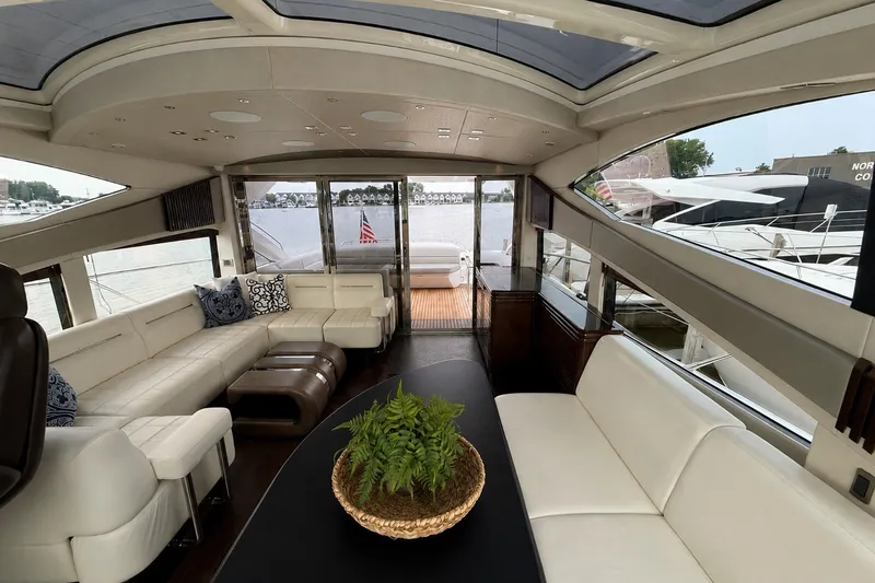 Slide: The Image of Luxurious interior of 2014 Sunseeker Predator 68 yacht with elegant seating and panoramic windows. - 27