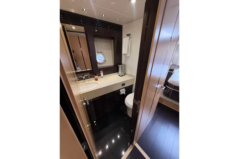 Slide: The Image of Luxurious bathroom in 2014 Sunseeker Predator 68 yacht, featuring modern fixtures and elegant design. - 44